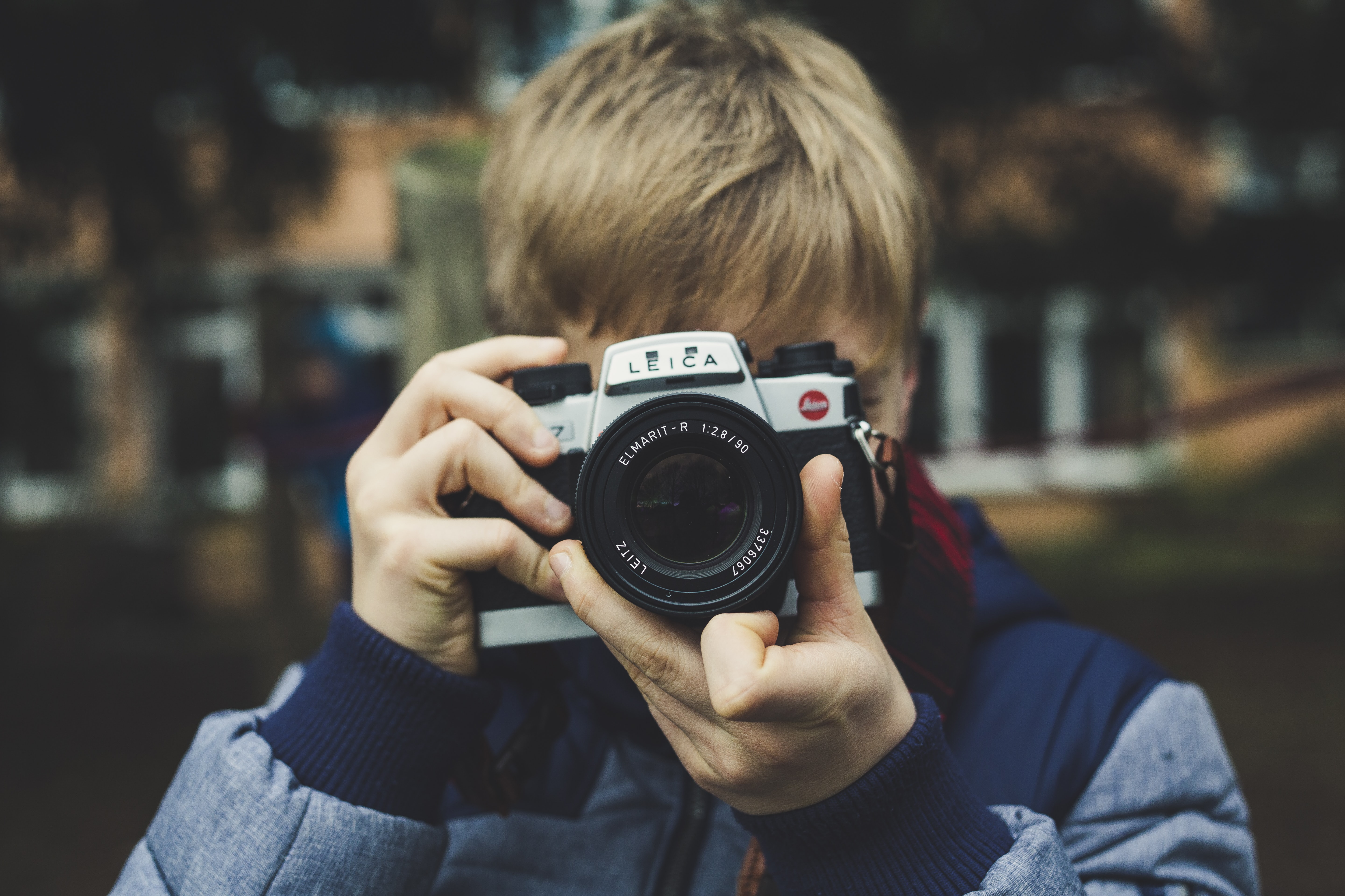 photo of man holding camera